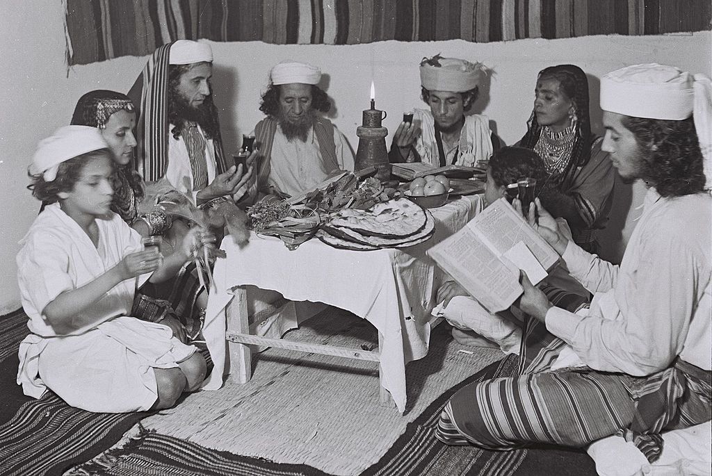 "A Yemenite Habani family celebrating the Passover seder at their new home in Tel Aviv" (credit: Zoltan Kluger, license: PD)