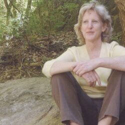 Rabbi Ellen Bernstein on a rock